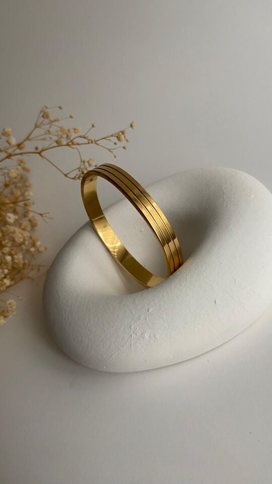 Gold üzeri çizgili elips kelepçe